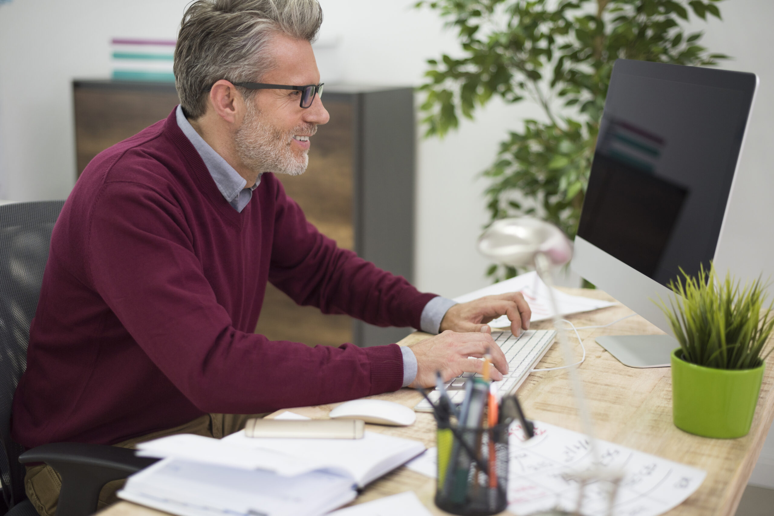 Affectionate man working on his computer